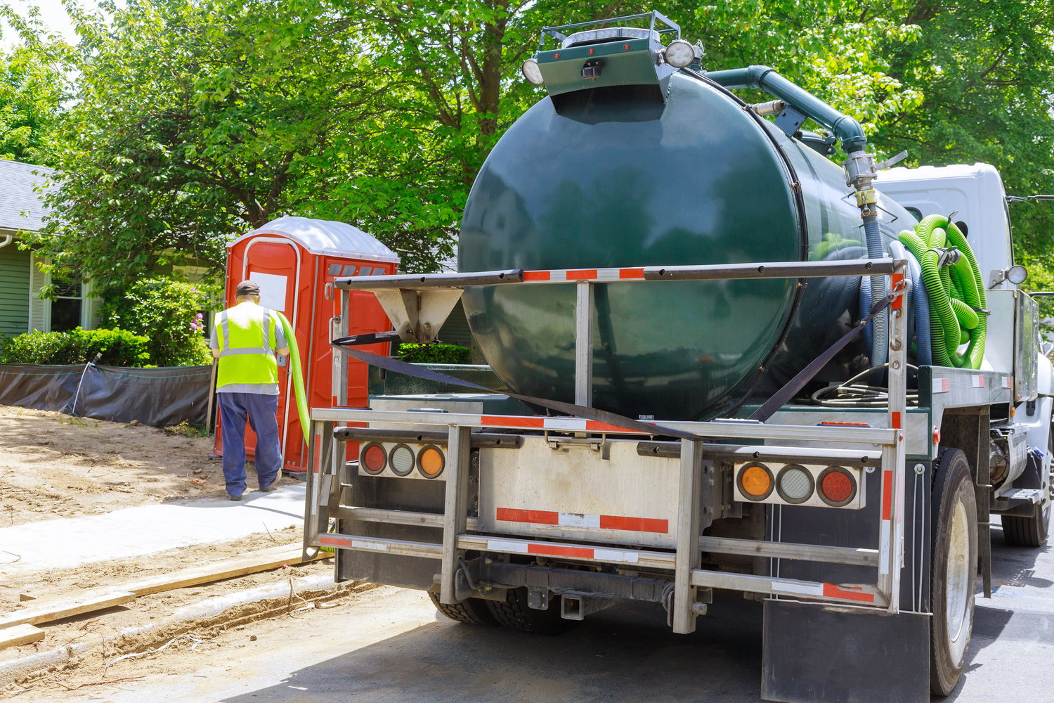 Septic Pumper Truck Parked Outside a House